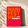 'Manifest My Moment' Planner Cover with a red and pink checkered design on a light background