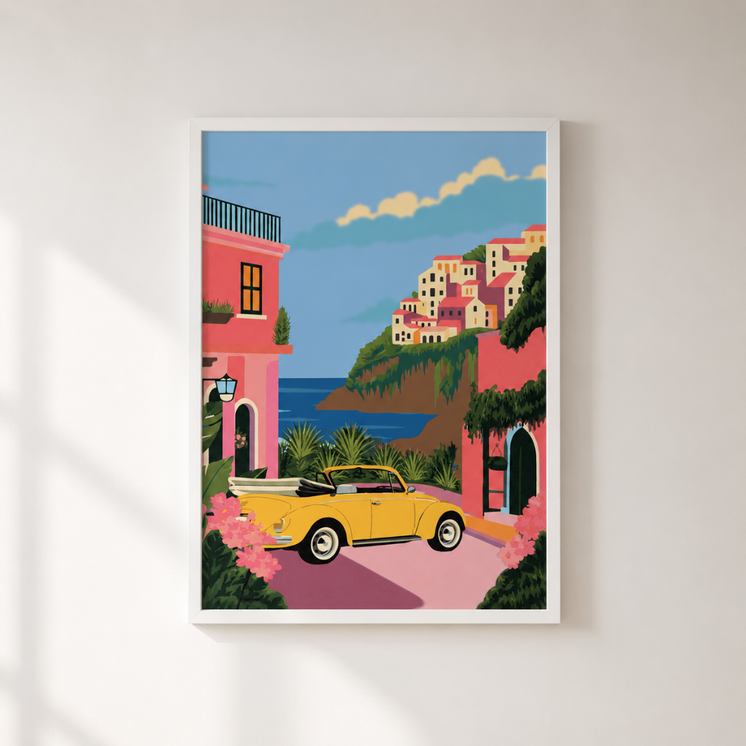 Framed artwork of a coastal scene with a yellow car, houses, and ocean.